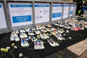 white shoes lined up on black tarp